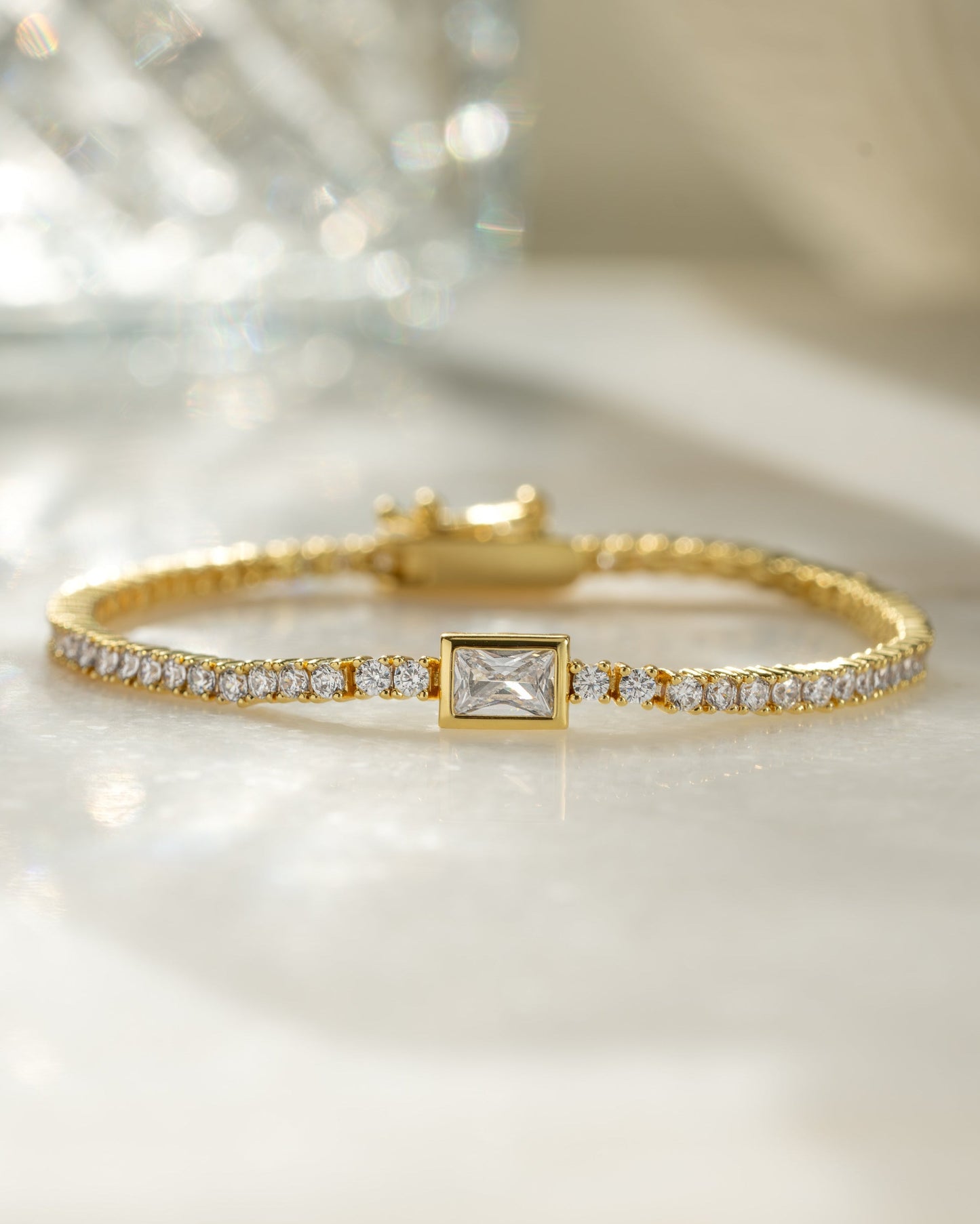 Bezeled Emerald-Cut Charm Tennis Bracelet