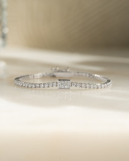 Bezeled Emerald-Cut Charm Tennis Bracelet